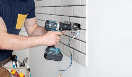 electrician construction worker overalls with drill installation sockets home renovation concept 1