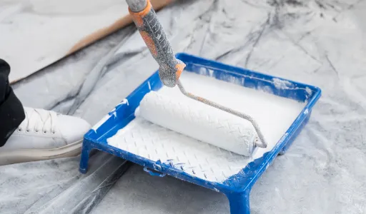 high angle contractor painting house wall 1